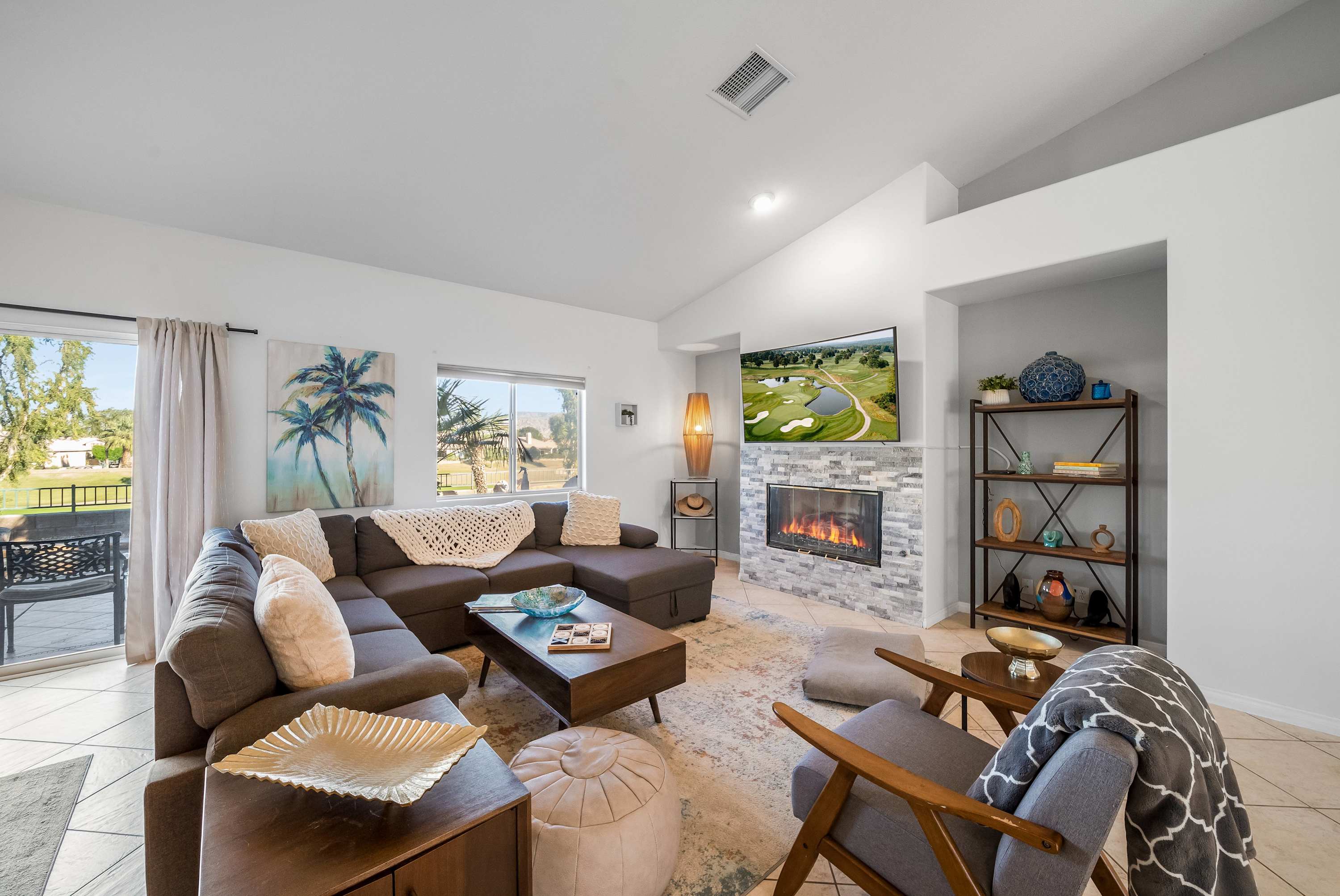 Living room with fireplace and vaulted ceilings